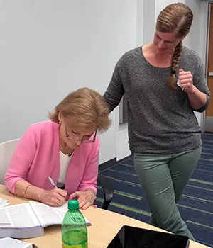 Wakefield was happy to autograph the textbook used in the class, which features a forward written by her
