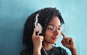 Woman in Black Crew Neck Shirt Wearing Headphones