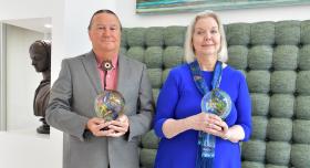 Drs. Sharon Horner and John Lowe holding their awards.