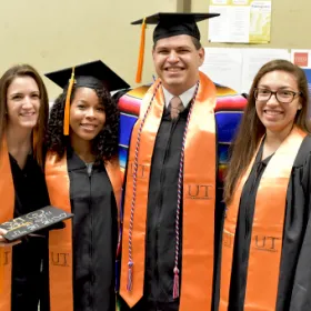 The University of Texas at Austin School of Nursing students dressed on caps and gowns for their graduation ceremony.