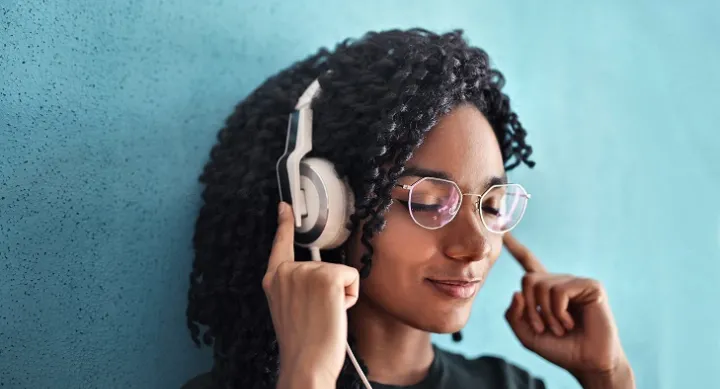 Woman in Black Crew Neck Shirt Wearing Headphones Woman in Black Crew Neck Shirt Wearing Headphones