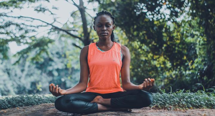 Woman meditating in the outdoors