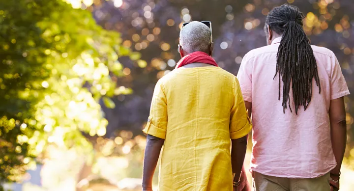 Rear view of senior couple walking