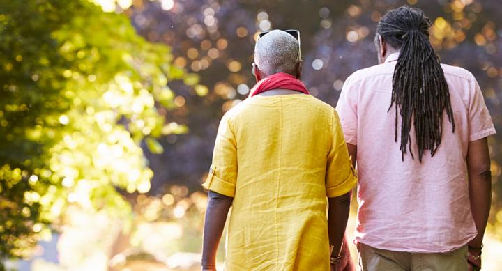 Rear view of senior couple walking