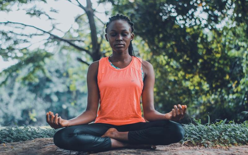 Woman meditating in the outdoors